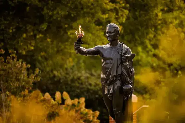 UT's torchbearer statue holds a torch early in the morning.